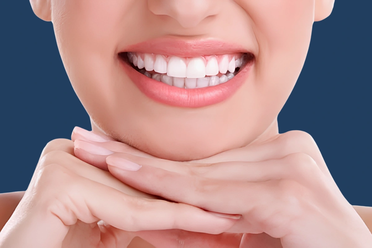 Close-up of a smiling person with bright, healthy teeth illustrating cosmetic dentistry options including teeth whitening and dental veneers.